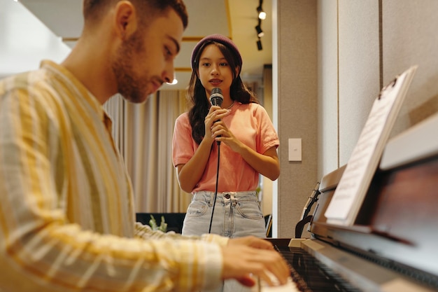 Group singing class participants learning harmony and vocal skills together