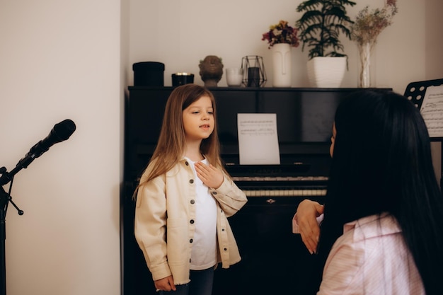 Student practicing vocal exercises during interactive singing lessons with music teacher